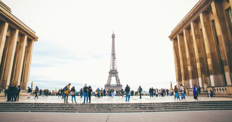 france tours people standing while watching Eiffel tower