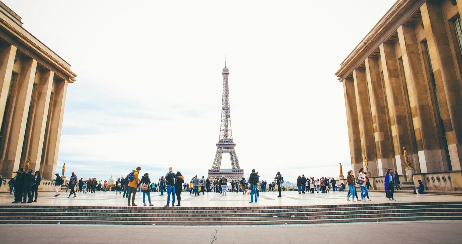 france tours people standing while watching Eiffel tower