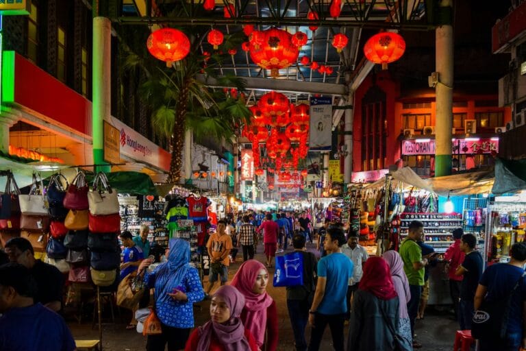 Malaysia Tours people walking on street during nighttime