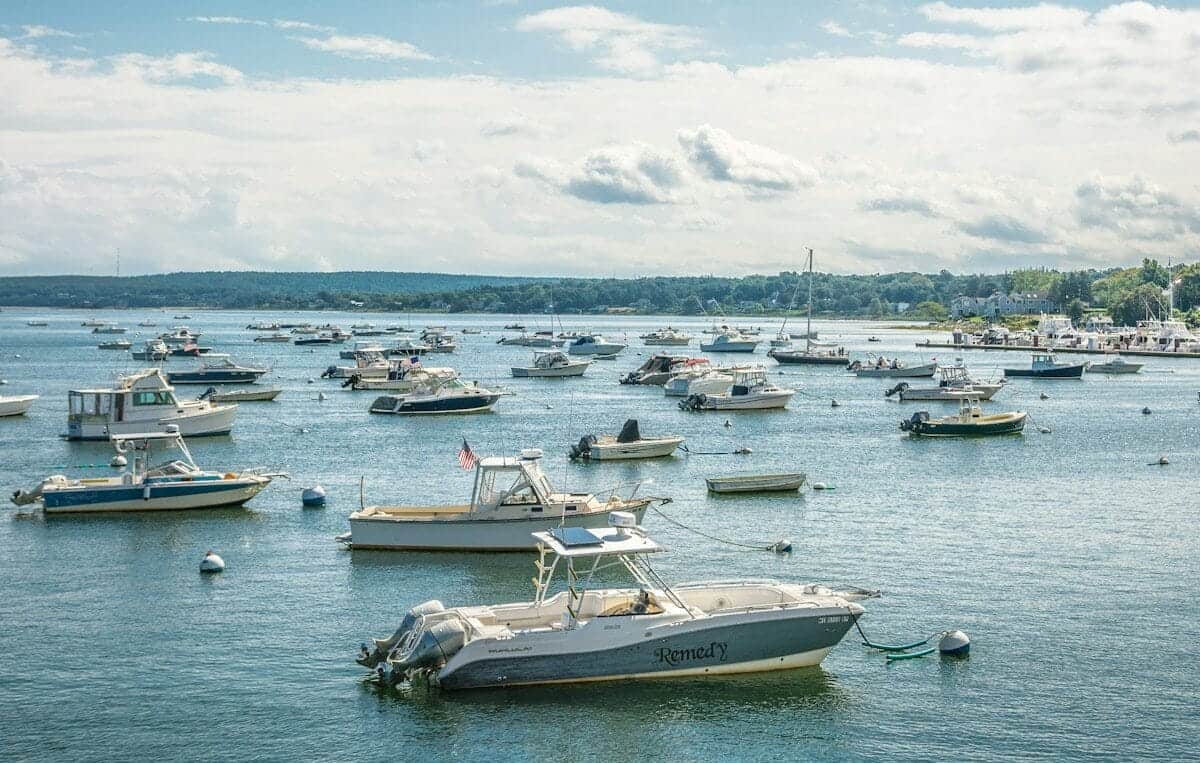 Montserrat Tour white and blue boat on sea under blue sky during daytime
