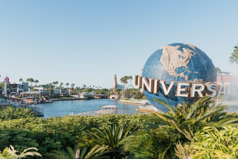 Orlando Tours blue and white globe near body of water during daytime