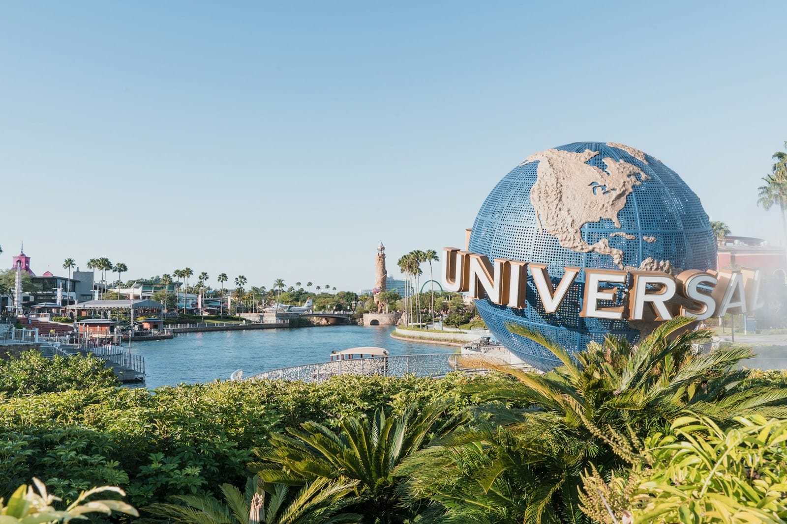 Orlando Tours blue and white globe near body of water during daytime