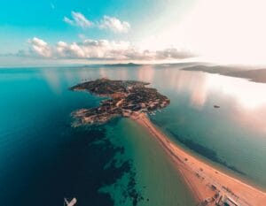 Sardinia Travel Guide an aerial view of a beach and a body of water