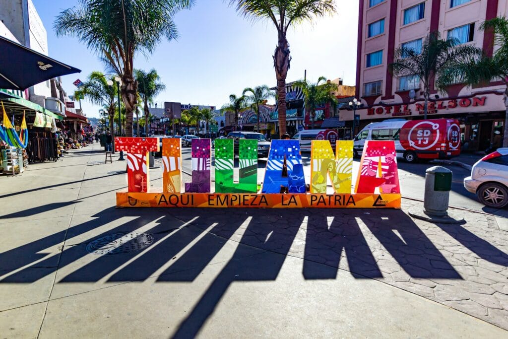 Tijuana Tours assorted colored plastic bags on street during daytime