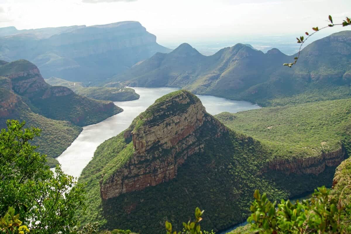 Southern Africa Travel Guide green and brown mountain beside body of water during daytime