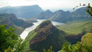 Southern Africa Travel Guide green and brown mountain beside body of water during daytime