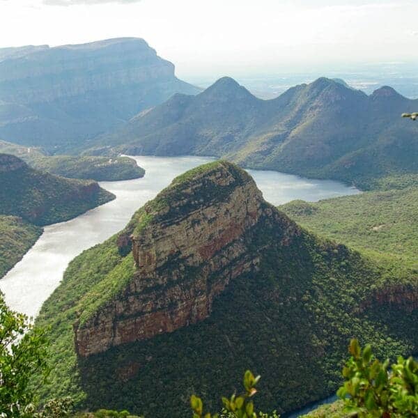 Southern Africa Travel Guide green and brown mountain beside body of water during daytime