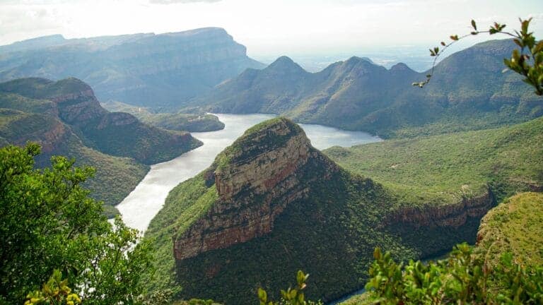 Southern Africa Travel Guide green and brown mountain beside body of water during daytime