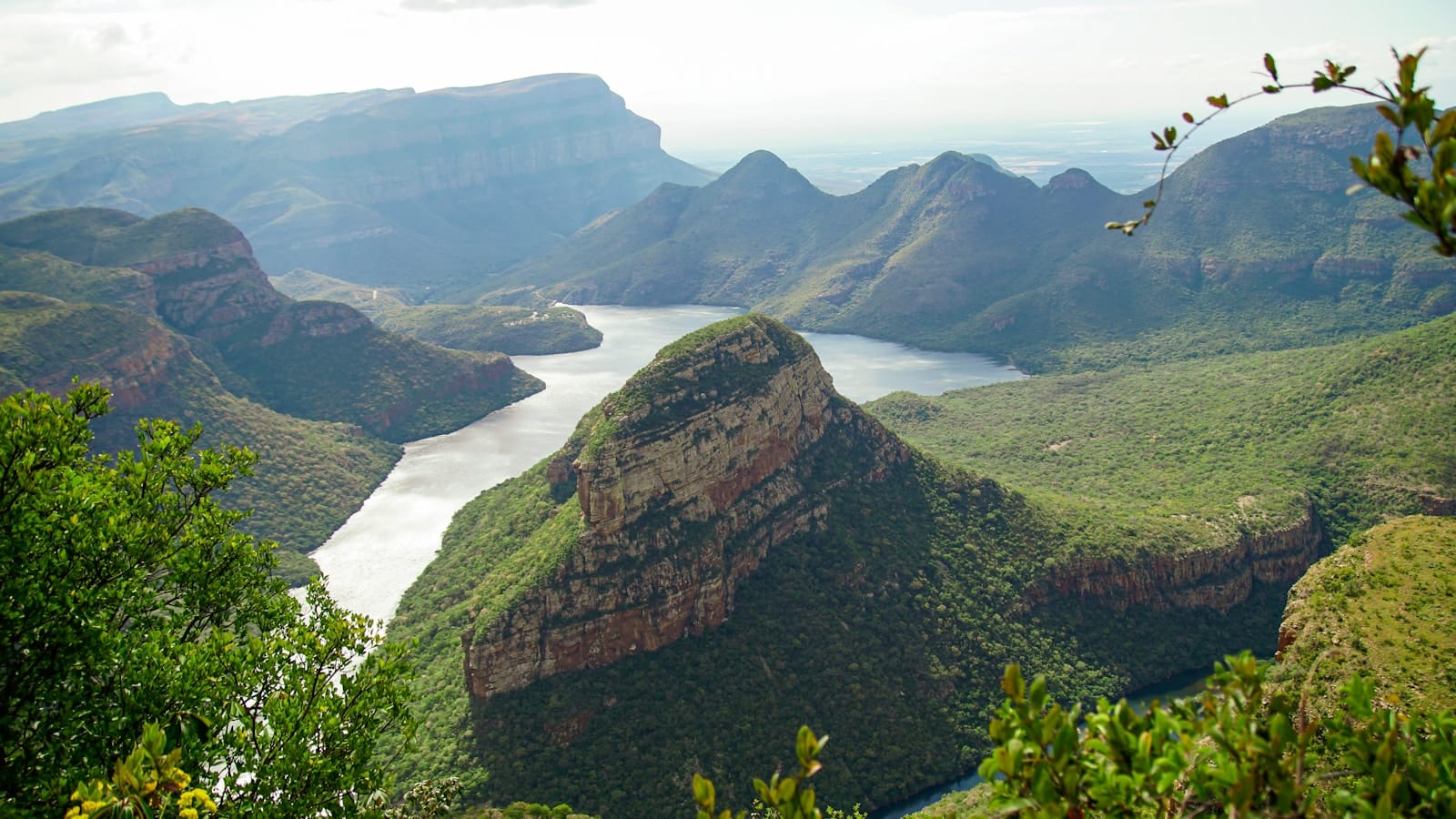Southern Africa Travel Guide green and brown mountain beside body of water during daytime