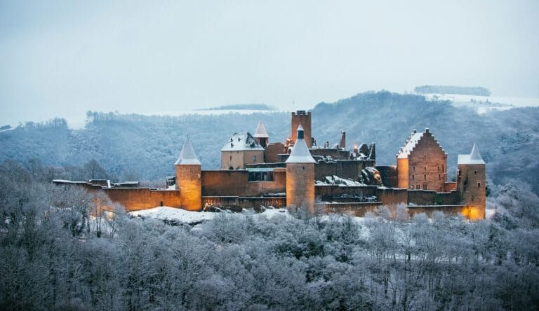 Luxembourg Tours photo of gray concrete castle surrounded by trees