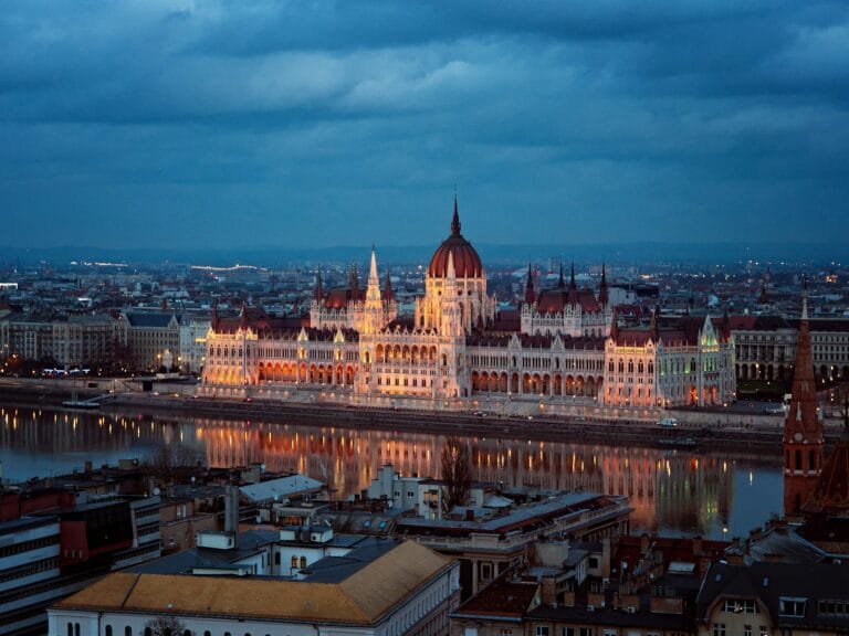 Budapest Travel Guide brown and white concrete building during night time