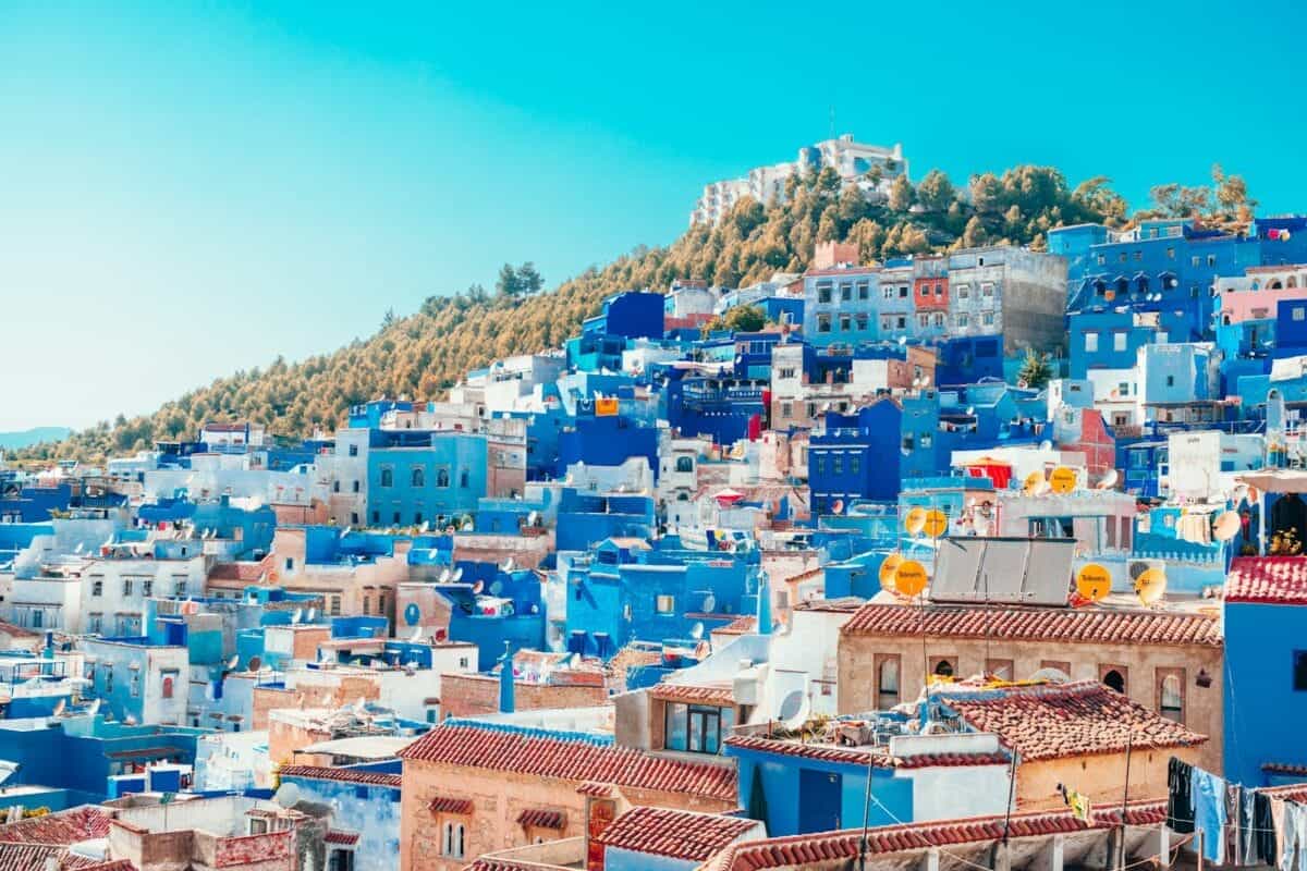 Morocco Tours blue and white painted houses on the cliff