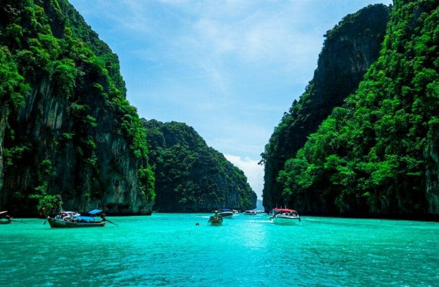 phuket tours boats on sea near mountain during daytime
