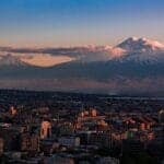 Armenia Travel Guide a view of a city with a mountain in the background