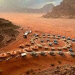 Jordan Tours a view of a desert with many tents in the middle of it