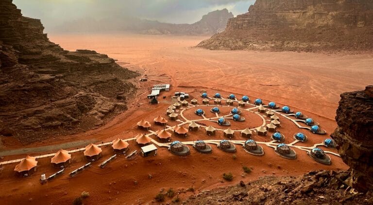 Jordan Tours a view of a desert with many tents in the middle of it