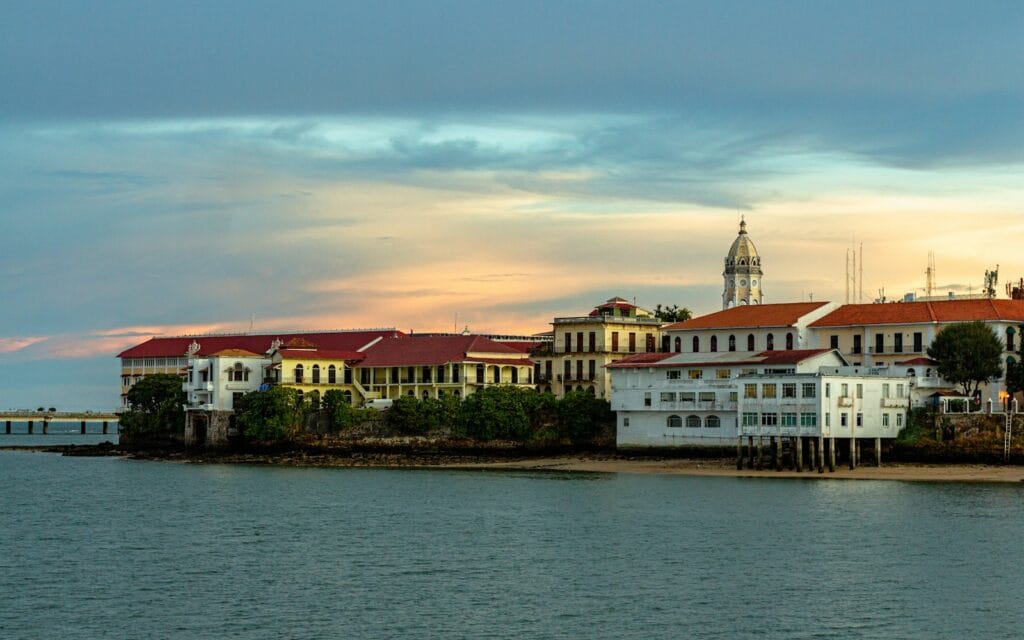 Panama Tours white and brown concrete building near body of water during daytime