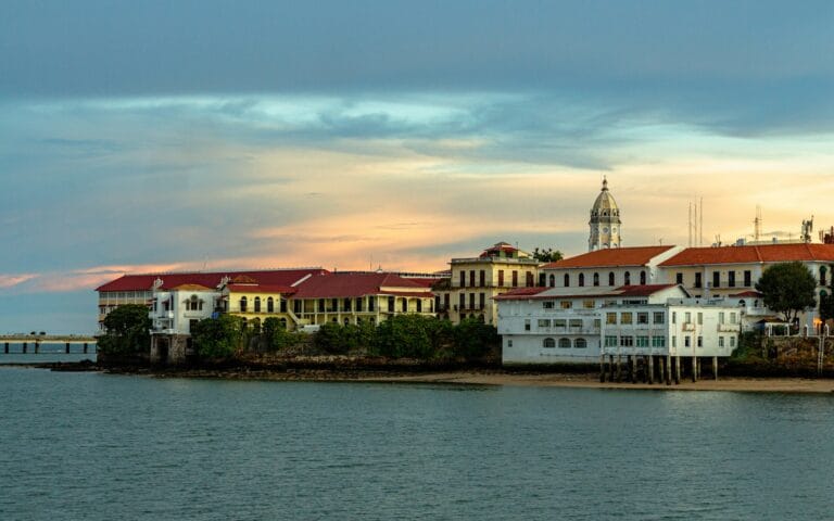 Panama Tours white and brown concrete building near body of water during daytime