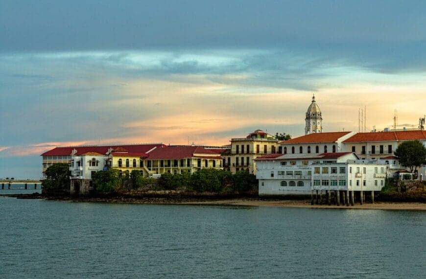 Panama Tours white and brown concrete building near body of water during daytime