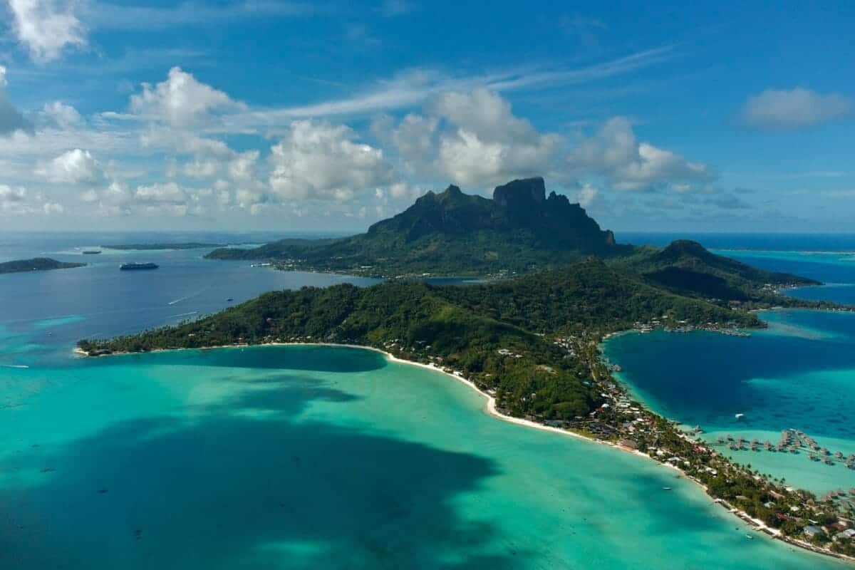 French Polynesia Tours an aerial view of an island in the middle of the ocean