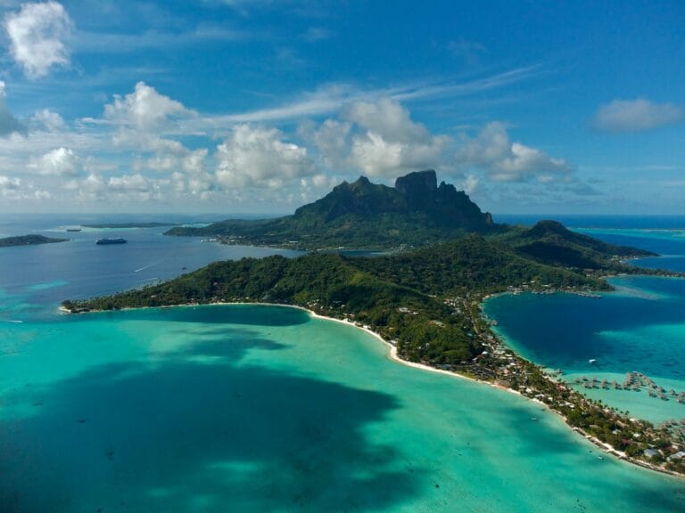 French Polynesia Tours an aerial view of an island in the middle of the ocean