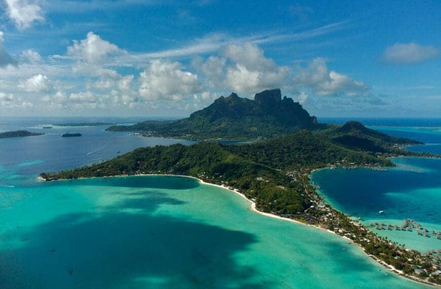 French Polynesia Tours an aerial view of an island in the middle of the ocean