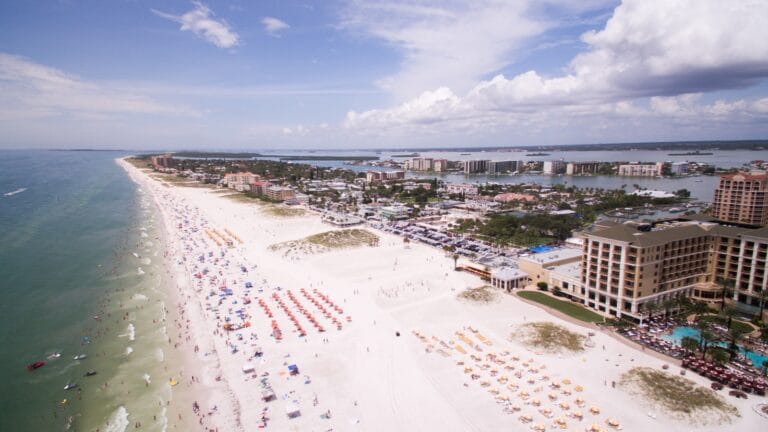 tampa travel guide aerial photography of people on the beach across buildings at daytime