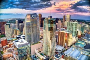 Denver Tours high rise buildings under white clouds and blue sky during daytime