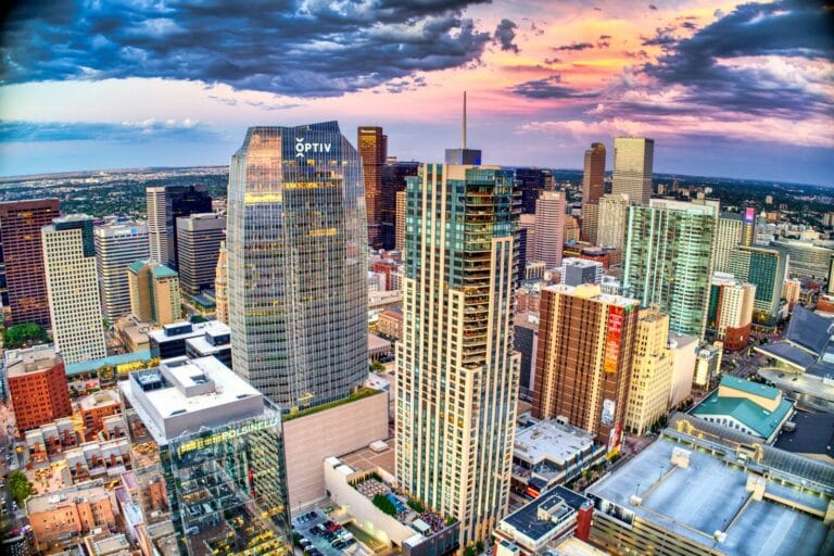 Denver Tours high rise buildings under white clouds and blue sky during daytime