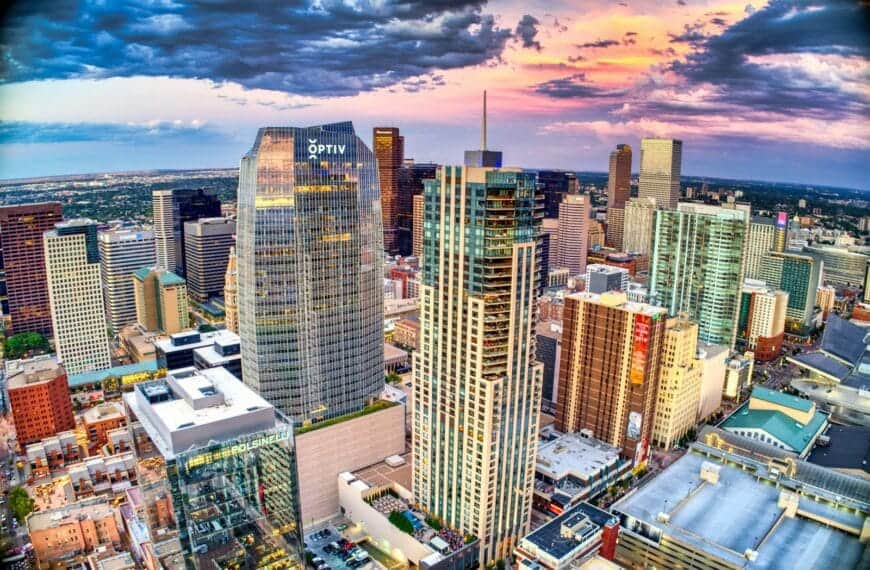 Denver Tours high rise buildings under white clouds and blue sky during daytime