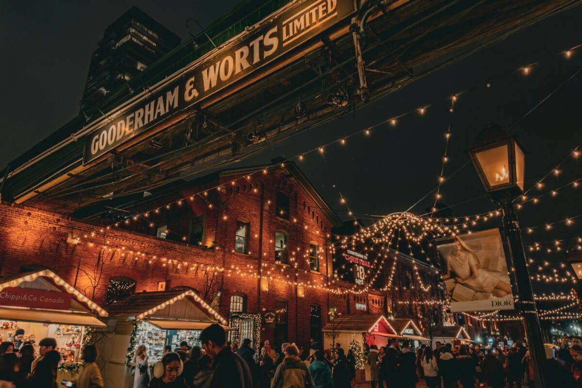 Distillery Historic District a crowd of people walking around a christmas market