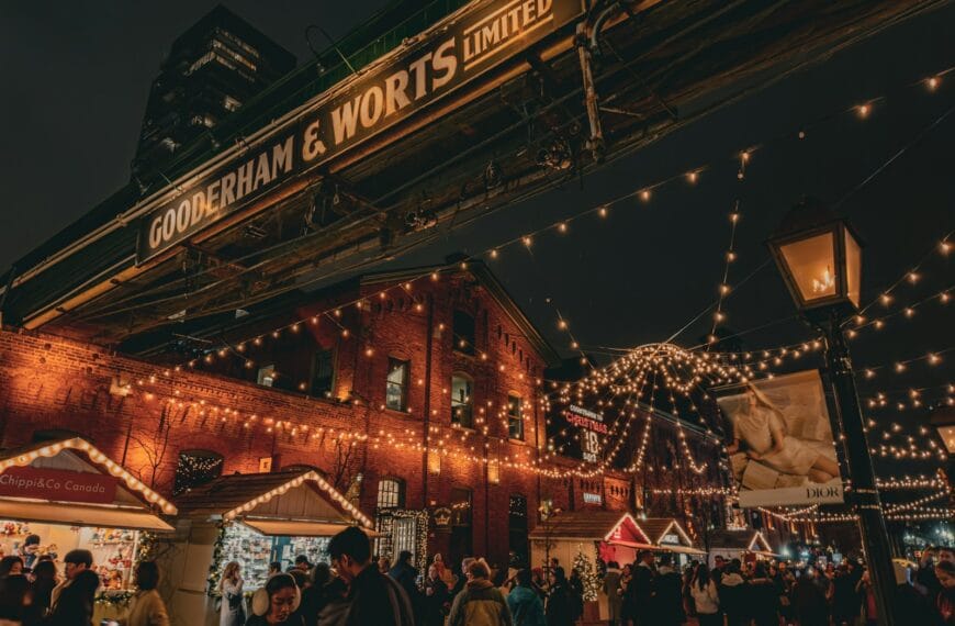 Distillery Historic District a crowd of people walking around a christmas market