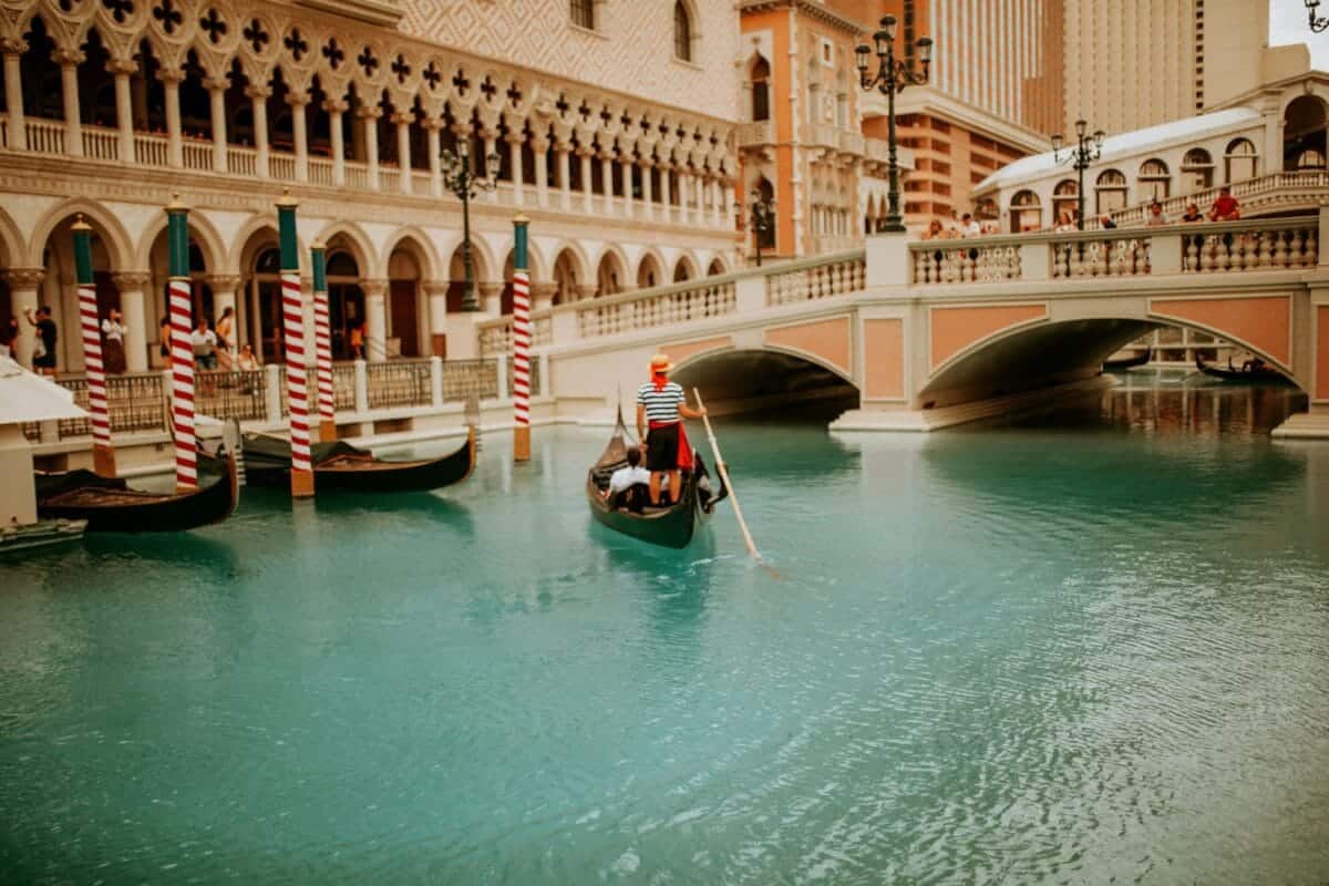 Gondola Rides at The Venetian Tours man riding on boat near building