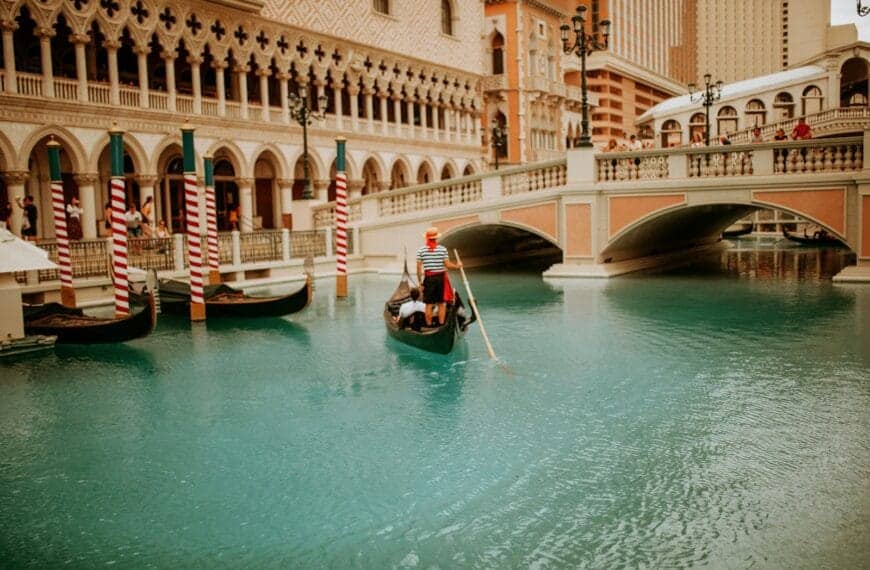 Gondola Rides at The Venetian Tours man riding on boat near building