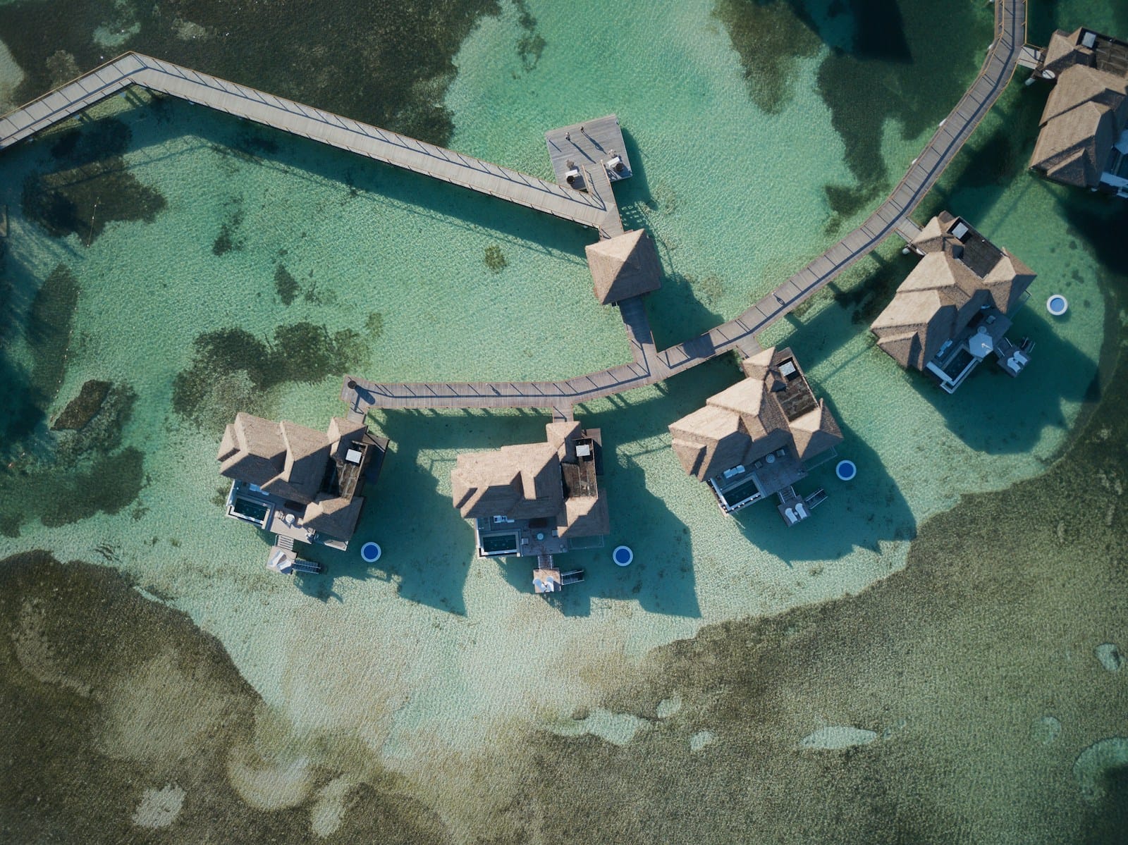 Jamaica Tours a bird's eye view of a group of huts in the water
