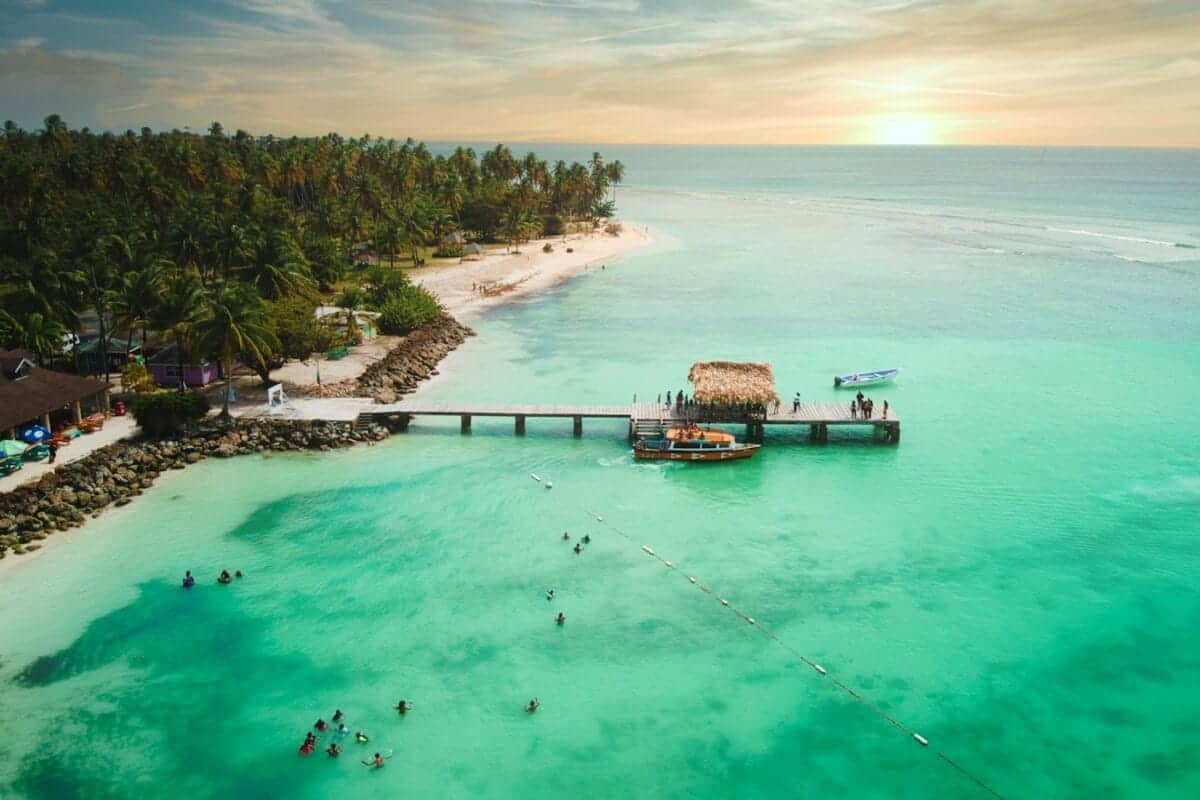 Trinidad and Tobago tours brown wooden house on green body of water during daytime