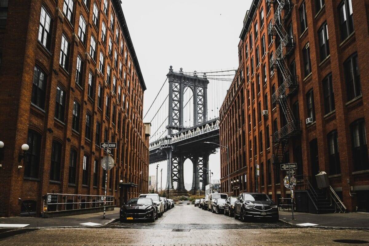 New York Tours cars parked near brown building