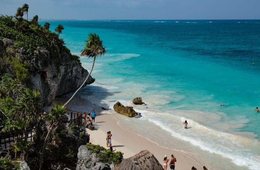 Riviera Maya Travel Guide people walking on seashore during daytime