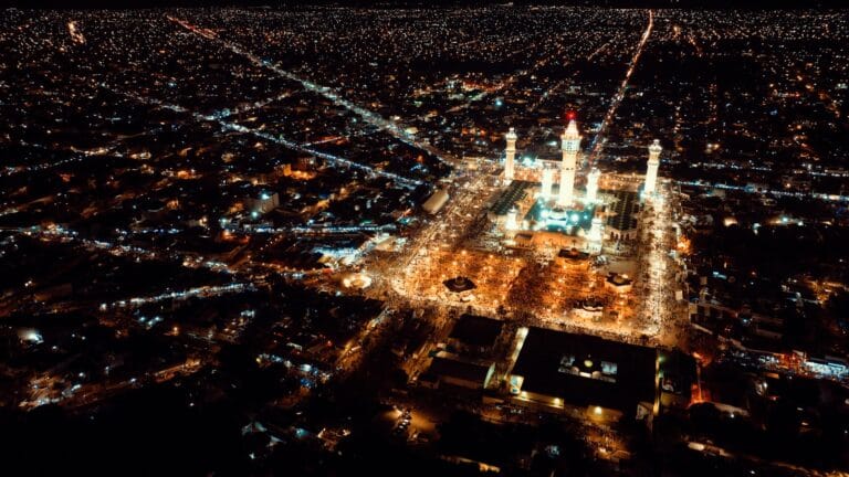 Senegal Travel Guide a large building with a tower in the middle of a city