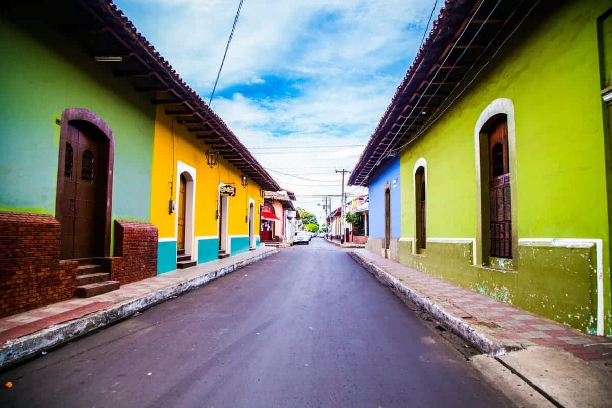 Nicaragua Travel Guide pathway of houses under blue clouds during daytime
