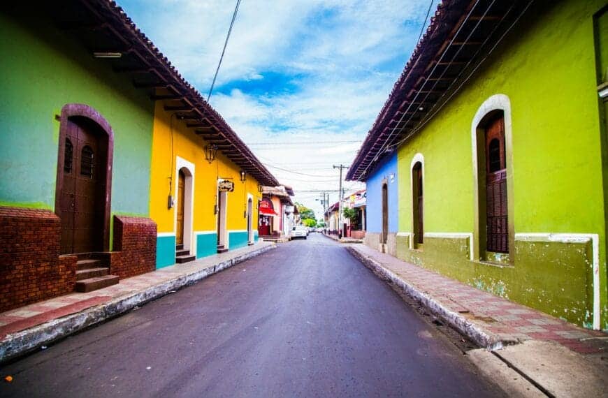 Nicaragua Travel Guide pathway of houses under blue clouds during daytime