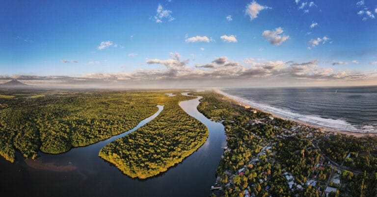 El Salvador Travel Guide green trees near body of water under blue sky during daytime