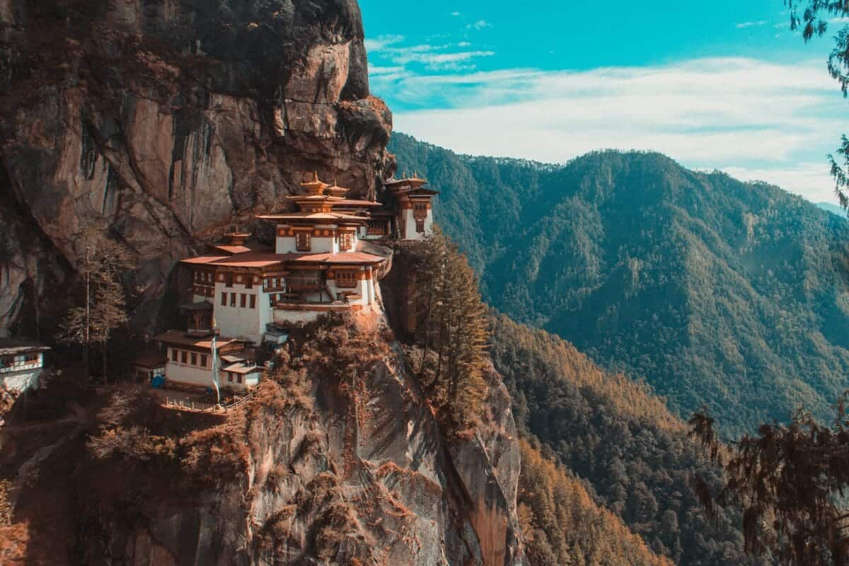 Bhutan Travel Guide Paro Taktsang temple in Bhutan viewing mountain under blue and white sky