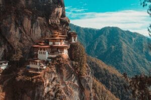 Bhutan Travel Guide Paro Taktsang temple in Bhutan viewing mountain under blue and white sky