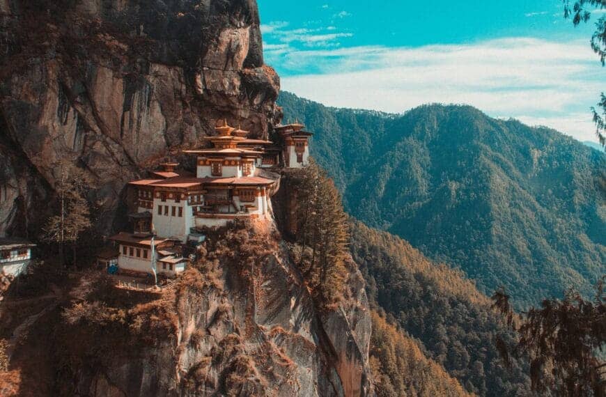 Bhutan Travel Guide Paro Taktsang temple in Bhutan viewing mountain under blue and white sky