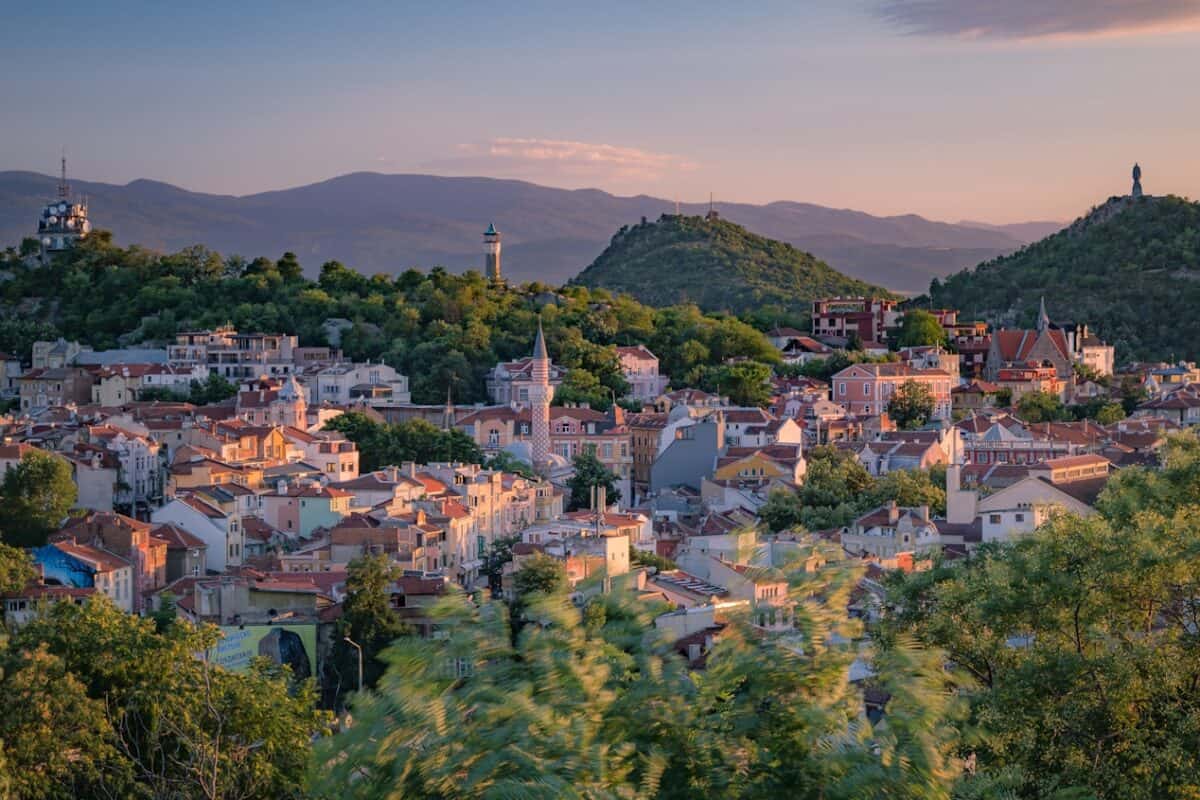 Bulgaria Travel Guide a small town surrounded by trees and mountains