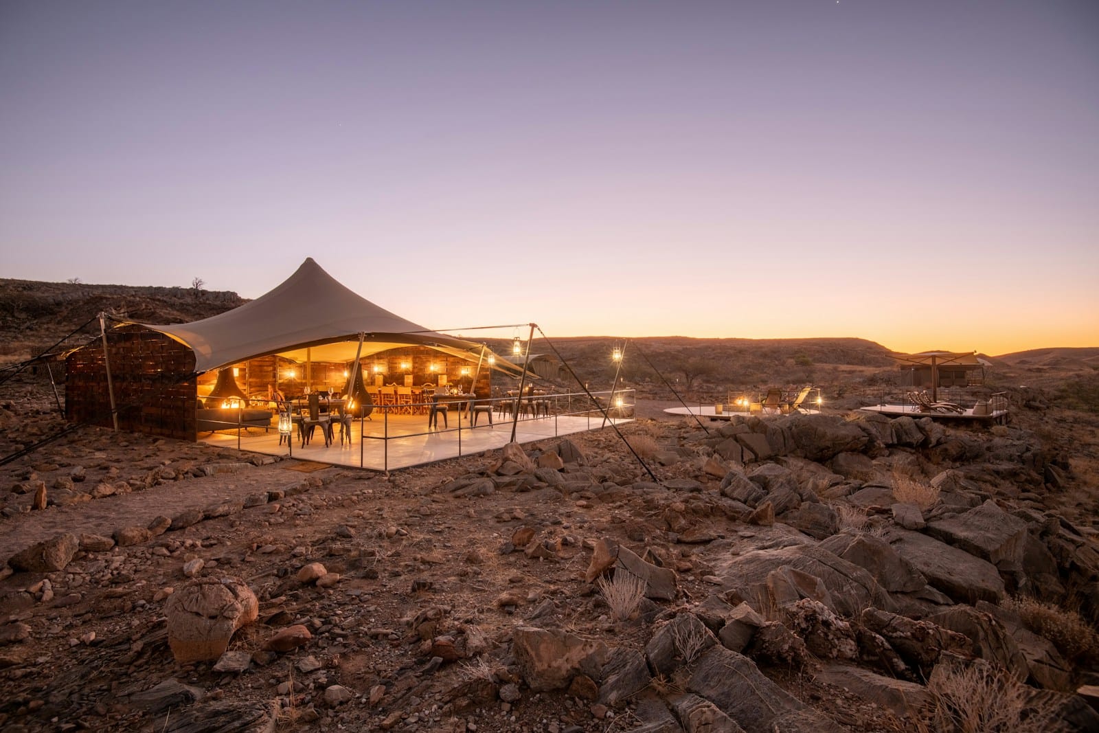 Namibia Travel Guide a tent set up in the middle of a desert