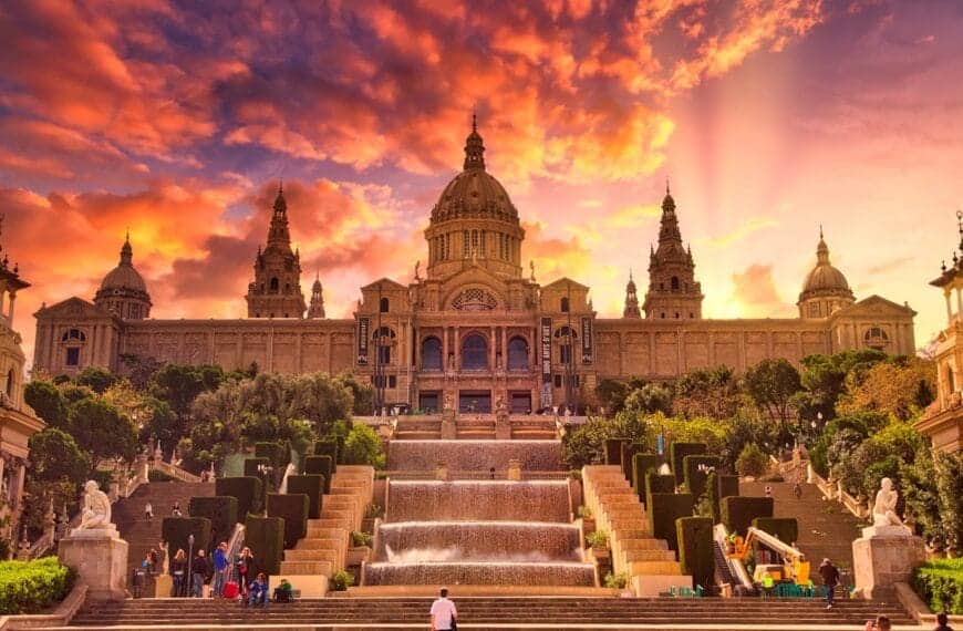 barcelona tours people sitting on bench near building during sunset