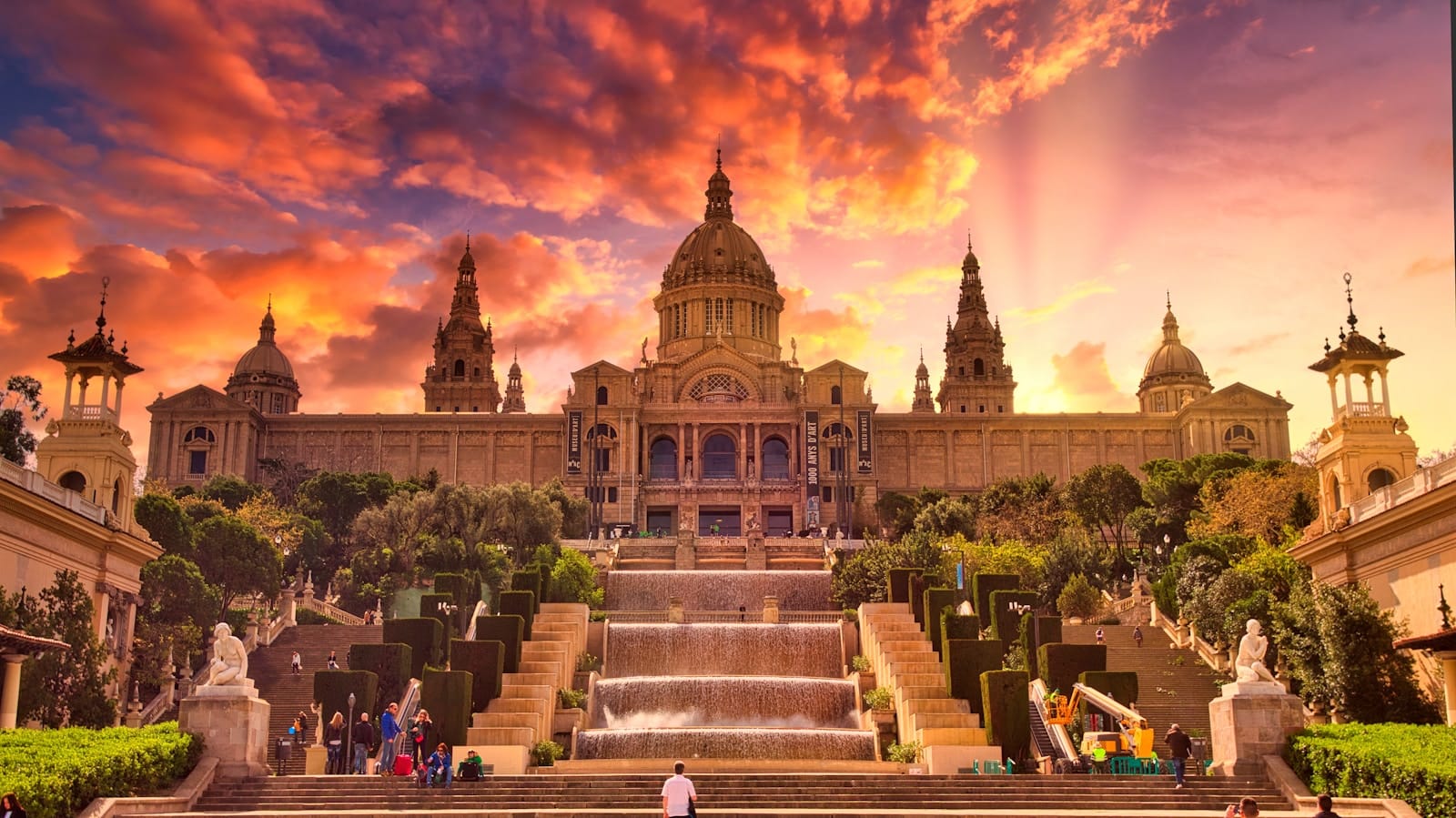 barcelona tours people sitting on bench near building during sunset