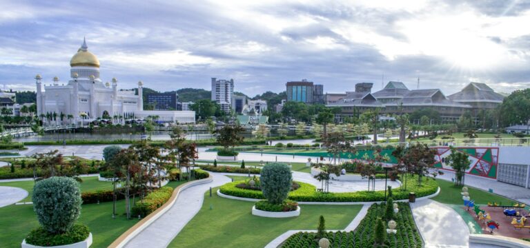 Brunei Travel Guide a large courtyard with a building in the background